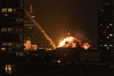 A fireball lights the sky following a missile strike on Tel Aviv on February 28, 2026. The United States and Israel launched strikes against Iran on February 28, with Israel's public broadcaster reporting that the Iranian supreme leader had been targeted, as the Islamic republic retaliated with barrages of missiles at Gulf states and Israel. 