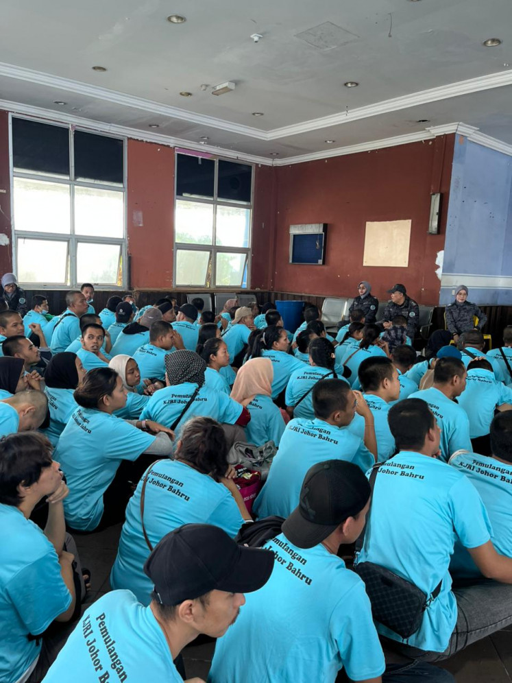 Indonesian deportees wait to be deported from Johor Bahru in the Malaysian state of Johor on Feb. 28, 2026, to Batam, Riau Islands. Malaysia deported a  total of 154 Indonesians from Johor Bahru because of immigration violations.
