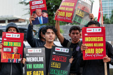 People take part in a protest outside the United States Embassy in Jakarta on March 3, 2026 to condemn the US-Israeli attack on Iran and urge the Indonesian government to revoke its membership of the US-led Board of Peace.
