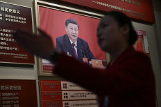 Political figure: A woman walks past a portrait of Chinaʼs President Xi Jinping on Sunday, March 1, 2026 at the Museum of the Communist Party of China in Beijing, ahead of the opening of the annual session of the National People&rsquo;s Congress (NPC).