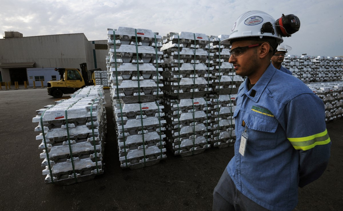 A Saudi engineer walks next to aluminum ingots on Nov. 23, 2016, produced by the Maaden Aluminium Factory, in the Ras Al-Khair Industrial area near Jubail, Saudi Arabia.