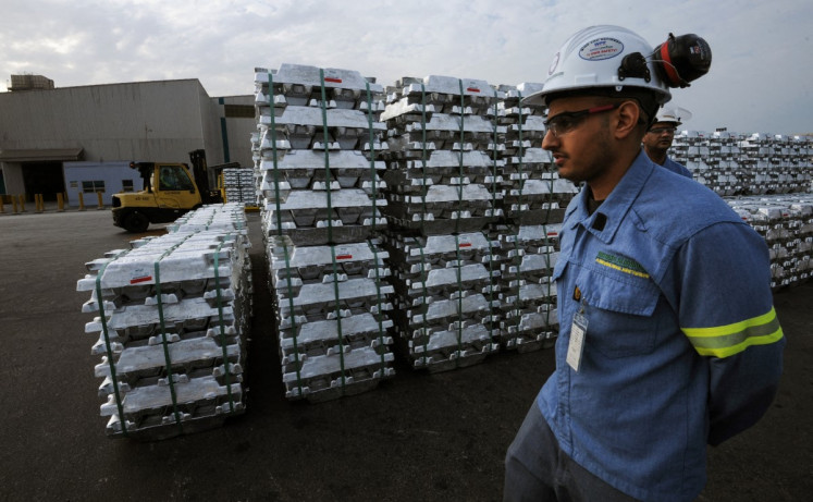 A Saudi engineer walks next to aluminum ingots on Nov. 23, 2016, produced by the Maaden Aluminium Factory, in the Ras Al-Khair Industrial area near Jubail, Saudi Arabia.