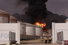 Flames and smoke rise from the Fujairah oil industry zone on Wednesday in the United Arab Emirates.