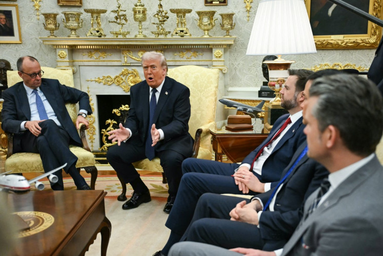 US President Donald Trump speaks during a meeting with German Chancellor Friedrich Merz in the Oval Office of the White House in Washington, DC on March 3, 2026. 