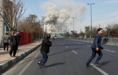 People run as smoke rises following an explosion, amid the US-Israeli conflict with Iran, in Tehran, Iran, March 5, 2026. 