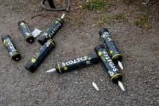 Discarded and empty nitrous oxide canisters are found on the street in Stockholm on May 1, 2025.