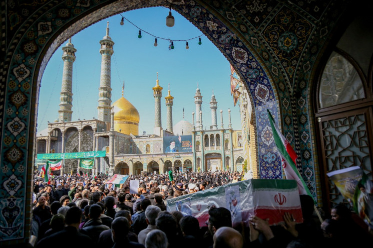 In this picture obtained from Iran's ISNA news agency on March 5, 2026, mourners in the city of Qom attend the funeral of those killed in the US-Israeli war with Iran. 