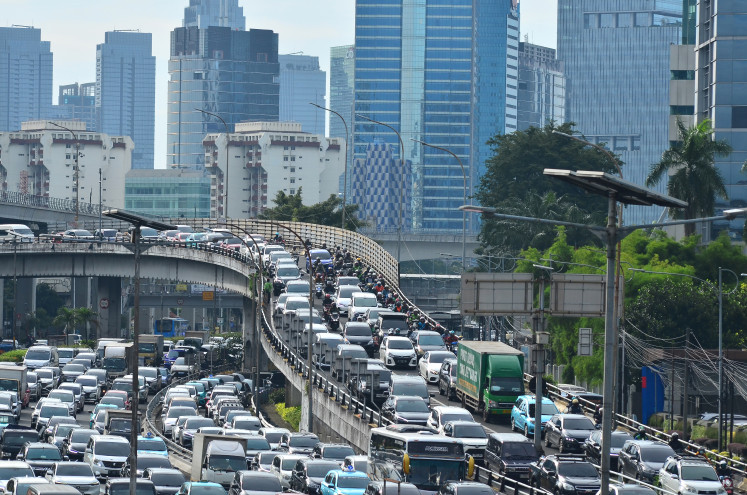 Choked up: Heavy rush hour traffic crawls along Jl. Gatot Subroto in South Jakarta.