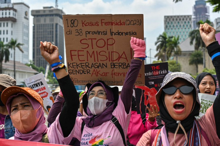 A placard against femicide, claiming 2023 statistics of some 180 reported cases across 38 provinces, is seen as activists take part in a street protest on Nov. 25, 2024, on the International Day for the Elimination of Violence Against Women in Jakarta.