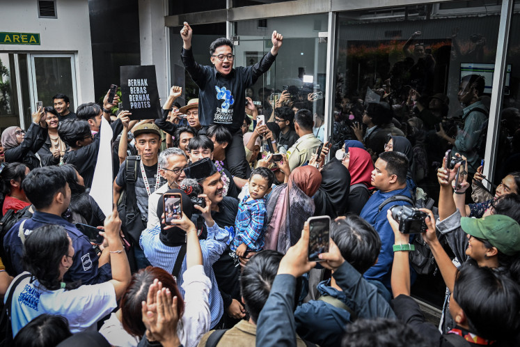 Lokataru Foundation director Delpedro Marhaen celebrates with supporters on March 6, 2026 after he and other activists were acquitted from charges of inciting nationwide riots in August 2025 at the Central Jakarta District Court in Jakarta.