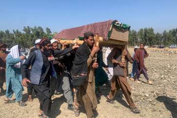 Relatives and mourners carry a coffin of a victim killed during Pakistani airstrikes in the Ghani Khel district of Nangarhar province, Afghanistan on March 1, 2026 amid ongoing cross-border fighting between Afghanistan and Pakistan. Afghan and Pakistani troops battled along their border, Afghan residents and officials told AFP on March 1, with the fighting coming alongside multiple strikes including the former US air base at Bagram.
