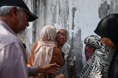 Relatives celebrate with a family member after he was released from Insein prison in Yangon, Myanmar, on March 2, 2026 to mark Peasants' Day. Myanmar's military junta on March 2 announced amnesties for more than 7,000 prisoners convicted of financing or sheltering a &ldquo;terrorist group&ldquo;, a designation it has used to outlaw pro-democracy factions opposing its rule.