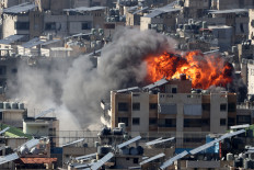 A fireball rises from the site of an Israeli air strike in the southern suburbs of Beirut on March 9, 2026.