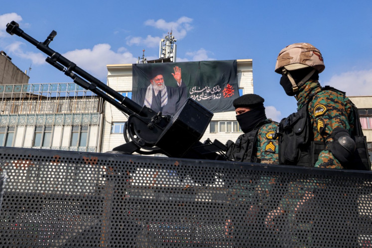 Security forces deploy to guard a rally in support of Iran's new Supreme Leader at Enghelab Square in central Tehran on March 9, 2026.