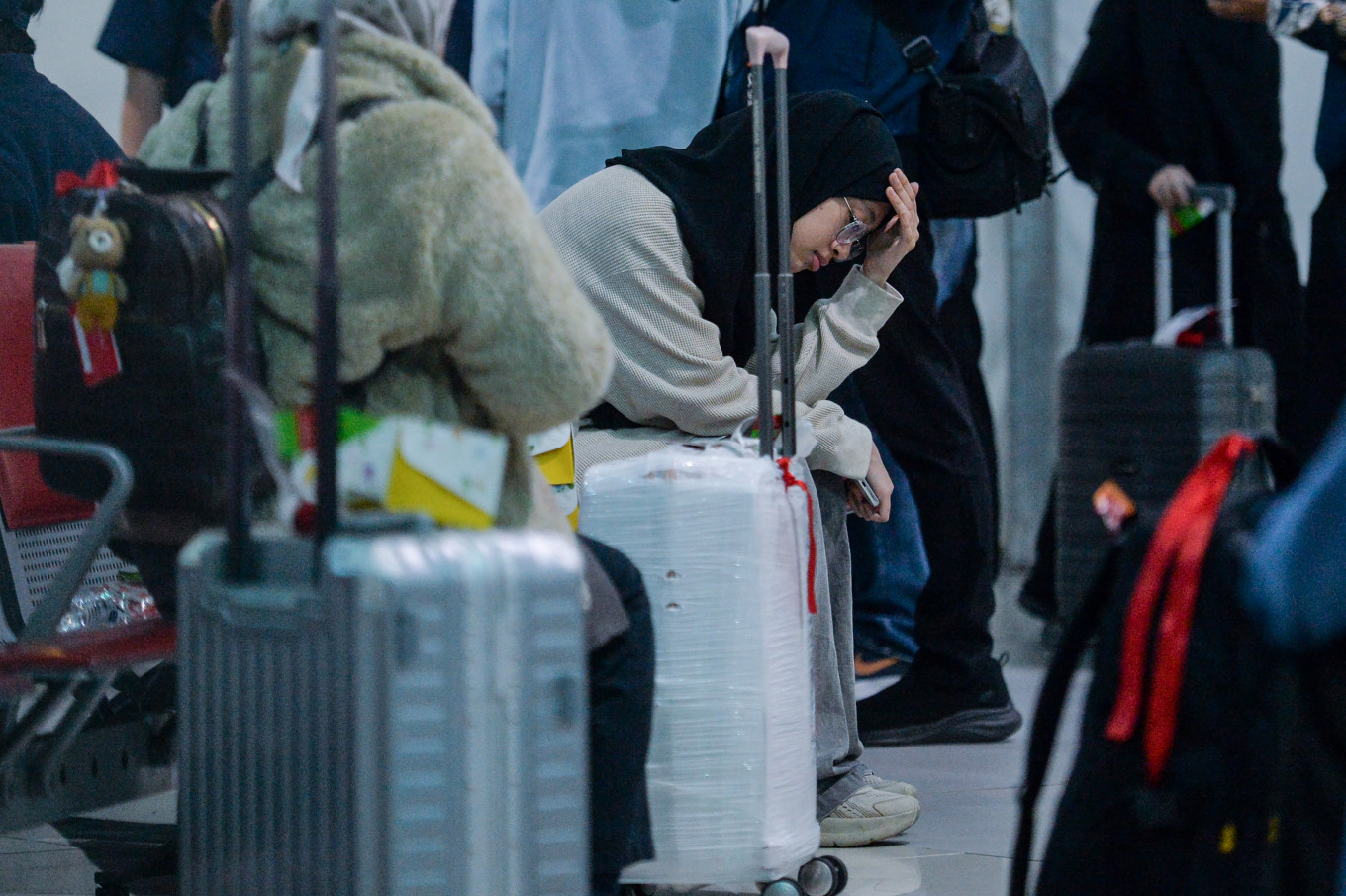 Safe home: Indonesian citizens evacuated from Iran wait on March 10, 2026, for the registration process at Terminal 3 of Soekarno-Hatta International Airport in Tangerang, Banten. The Foreign Ministry has facilitated the return of 22 Indonesians from Iran, marking the first wave of repatriation amid the United States-Israeli war on Iran.