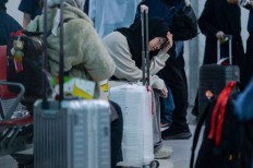 Safe home: Indonesian citizens evacuated from Iran wait on March 10, 2026, for the registration process at Terminal 3 of Soekarno-Hatta International Airport in Tangerang, Banten. The Foreign Ministry has facilitated the return of 22 Indonesians from Iran, marking the first wave of repatriation amid the United States-Israeli war on Iran.