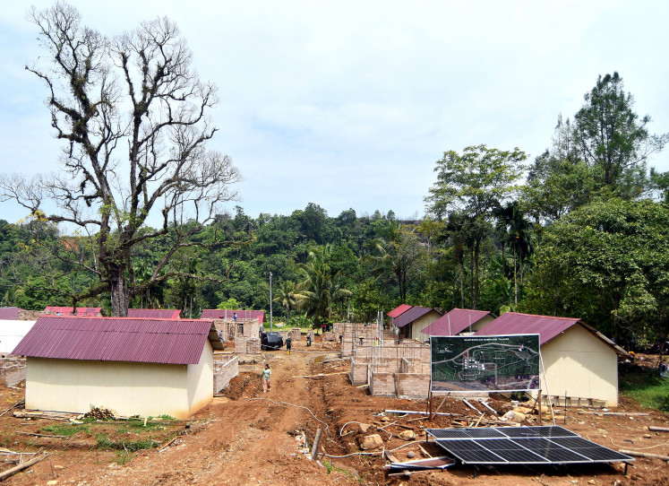 New build: Construction workers erect permanent housing for disaster survivors on March 7 in Kampung Talang, Koto Tuo, Pauh, Padang, West Sumatra.