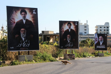 A photograph shows billboards depicting Iran's slain supreme leader Ayatollah Ali Khamenei and his son, Iran's new supreme leader Ayatollah Mojtaba Khamenei, displayed at the entrance to the southern Lebanese coastal city of Tyre on March 10, 2026.