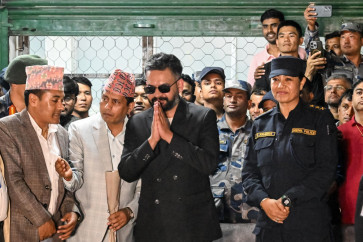 Rastriya Swatantra Party (RSP) election candidate Balendra Shah (center) greets supporters after collecting a certificate for his victory in parliamentary elections at the counting center in Damak in Nepal's Jhapa district on March 7, 2026. 