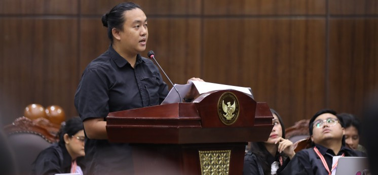 Commission for Missing Persons and Victims of Violence (Kontras) Andrie Yunus testifies during a hearing of judicial review against the revised Indonesian Military (TNI) Law at the Constitutional Court in Jakarta on July 14, 2025.