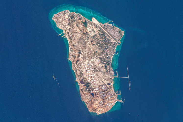This handout image taken on March 7, 2026 by the European Space Agency (ESA) captured by the Copernicus Sentinel-2 satellite shows a view of Iran's Kharg Island, which hosts the country's main crude export terminal and is responsible for the overwhelming majority of its oil shipments to the world, about 30 kilometres south of the mainland in the north of the Gulf. The island handles roughly 90 percent of Iran's crude exports, according to a JP Morgan note released on March 8.