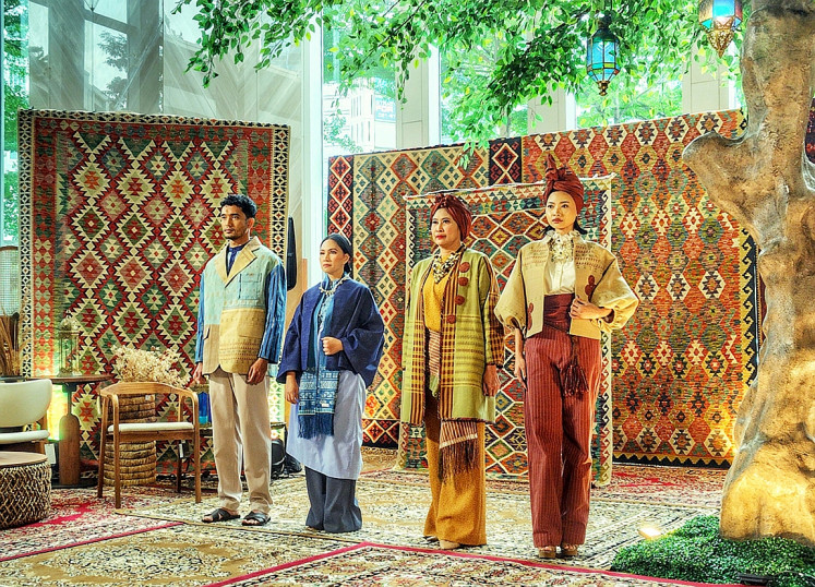 Models present a selection from Itang Yunasz&rsquo;s latest modest wear collection, crafted from handwoven textiles by Tobatenun, during a Ramadan 2026 showcase on Feb. 9 at the Sopo Del Tower in Kuningan, South Jakarta. JP/Sylviana Hamdani