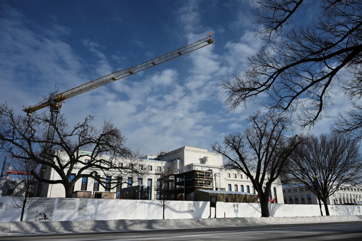 The United States Federal Reserve building is seen on Jan. 26 in Washington, DC. The US central bank is expected to leave interest rates unchanged this week, as the US-Israel war on Iran sends shock waves through markets while recent economic data showed weakness.