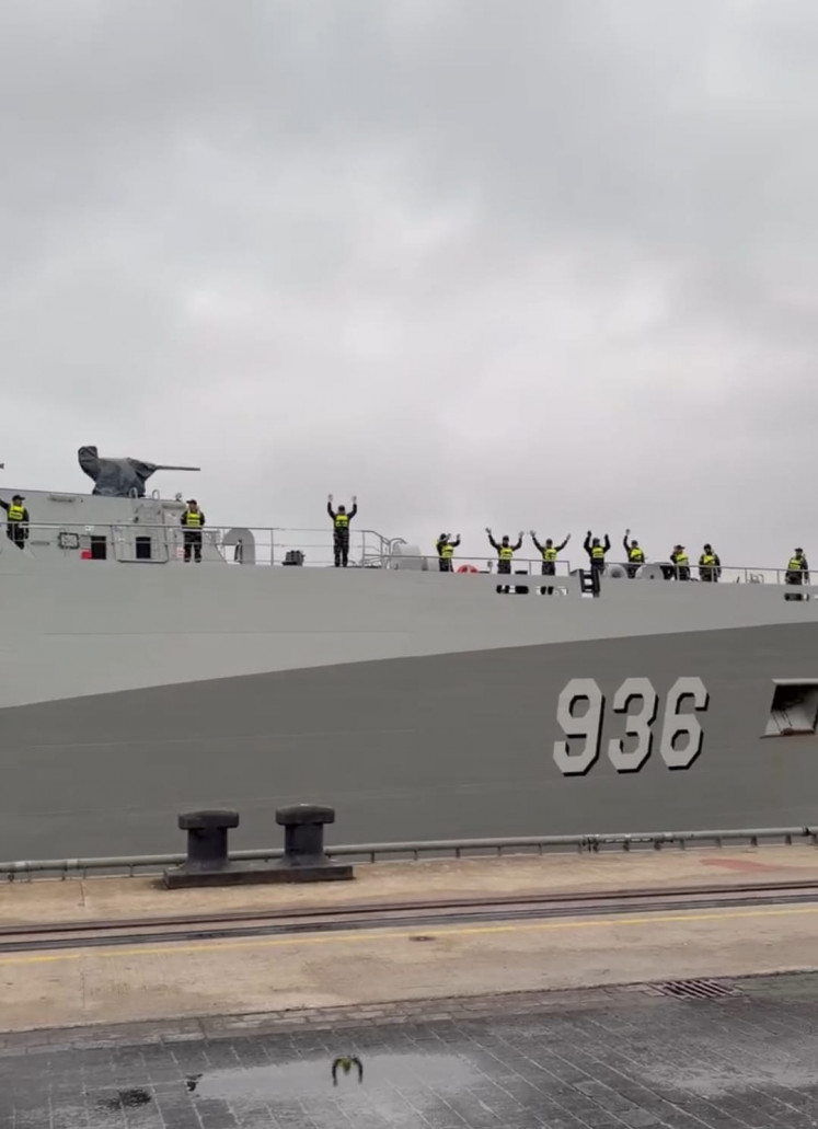 Crew of the Indonesian Navy's ship KRI Canopus wave on March 14 as they depart German shipyard Abeking & Rasmussen in Lemwerder, Bremen. The new oceano-hydrographic survey ship will take a longer route around the Cape of Good Hope on the southern tip of Africa following the outbreak of war caused by unprovoked attacks on Iran by the United States and Israel.