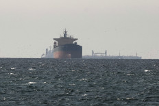 Supply at risk: Tankers sail in the Gulf, near the Strait of Hormuz, on March 11, 2026, as seen from northern Ras al-Khaimah, the United Arab Emirates, near the border with Oman&rsquo;s Musandam governance, amid the United States-Israel war on Iran.