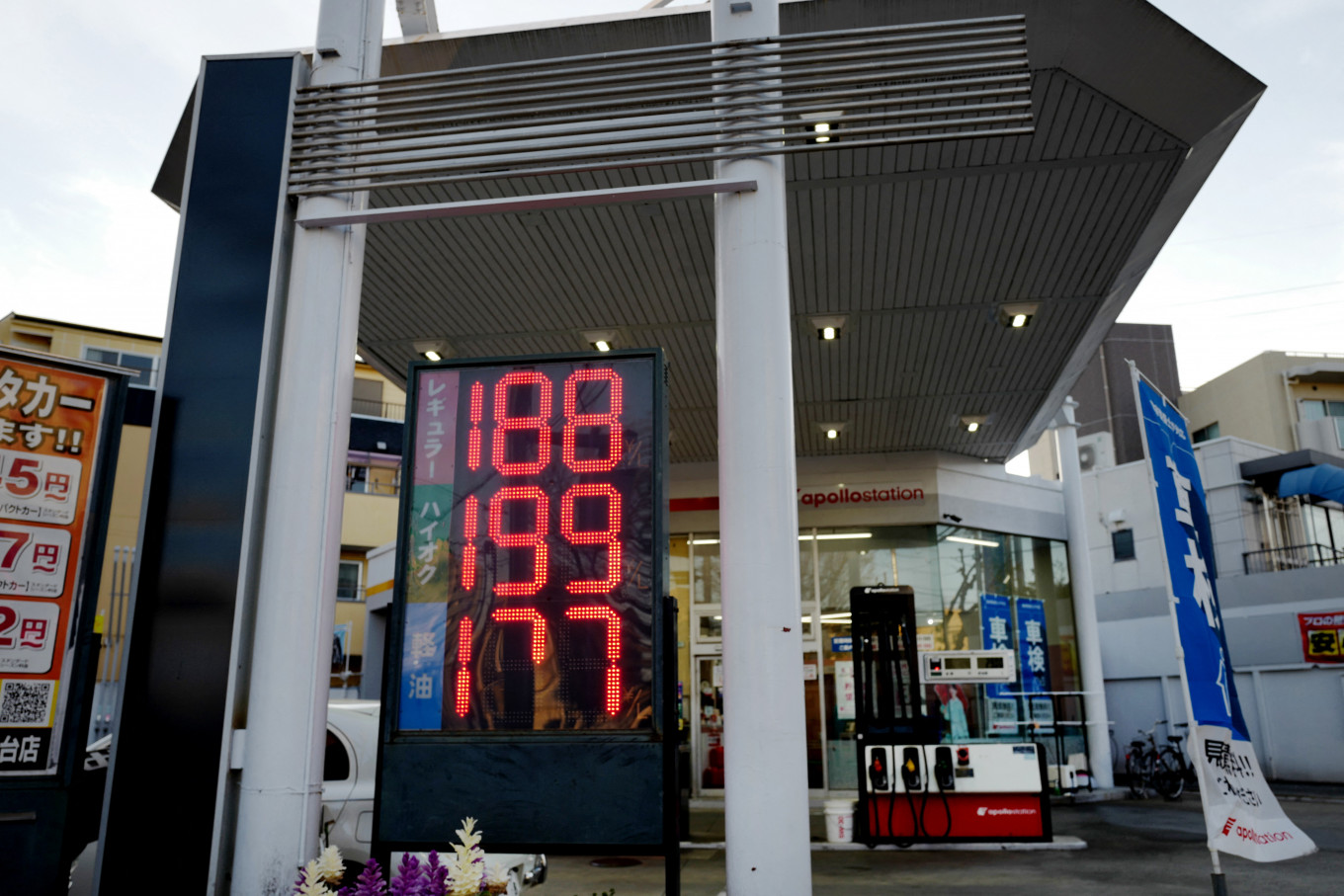 A sign at a gas station shows the price of gasoline, which has risen to 188 yen per liter for regular gasoline, in Tokyo on March 14, 2026, due to a sharp rise in crude oil prices sparked by the war in the Middle East.