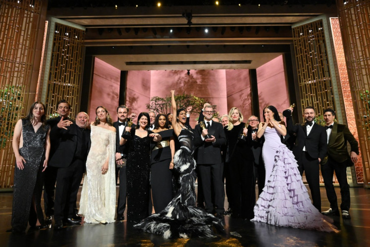 This handout picture courtesy of the Academy of Motion Picture Arts and Sciences (AMPAS) shows the cast and crew of &ldquo;One Battle After Another&ldquo; celebrating their Best Picture Oscar at the end of the 98th Annual Academy Awards at the Dolby Theatre in Hollywood, California on March 15, 2026. 