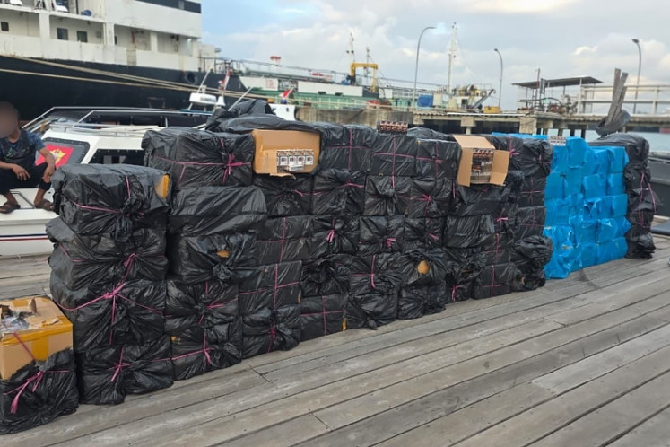 Cigarette bust: Boxes of illicit cigarettes are stacked on March 16, 2026, in Batam, Riau Islands. The illicit cigarettes were seized by Batam Customs officers from a speedboat that ran aground on Panjang Island.