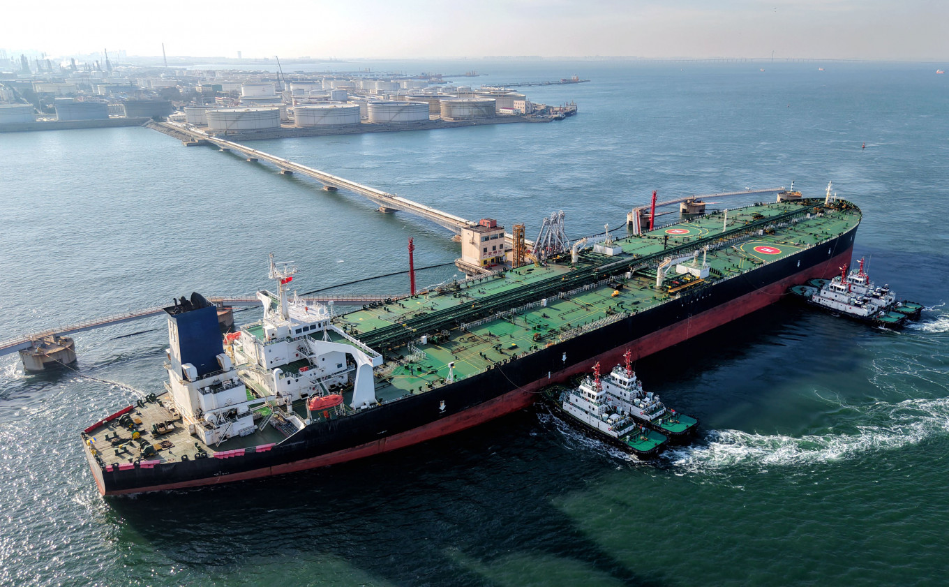 A crude oil tanker berths at the crude oil terminal at the port in Qingdao, in China's eastern Shandong province on March 19, 2026.