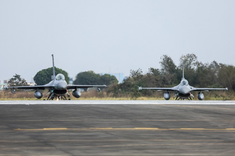 A pair of Taiwanese air force F-16V fighter aircraft prepare for take off during a military exercise at Chiayi Air Base in Chiayi on January 27, 2026.