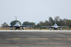 A pair of Taiwanese air force F-16V fighter aircraft prepare for take off during a military exercise at Chiayi Air Base in Chiayi on January 27, 2026.