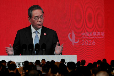 Chinese Premier Li Qiang on a big screen live broadcasting his speech at the opening of the China Development Forum 2026 held at the Diaoyutai State Guesthouse in Beijing, China, March 22, 2026. 