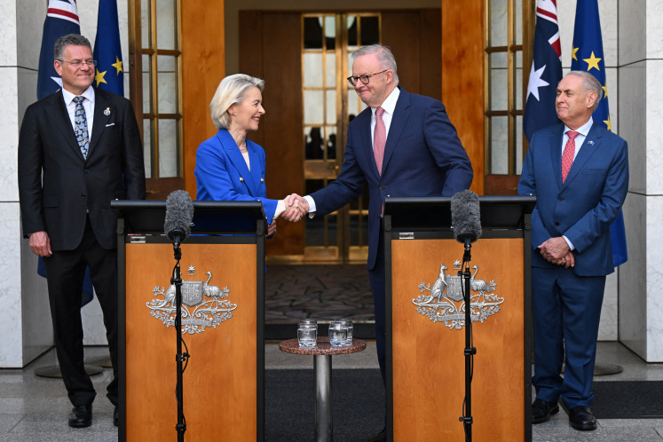 Australian Prime Minister Anthony Albanese and President of the European Commission Ursula von der Leyen shake hands during a press conference at Parliament House in Canberra, Australia, on March 24, 2026.