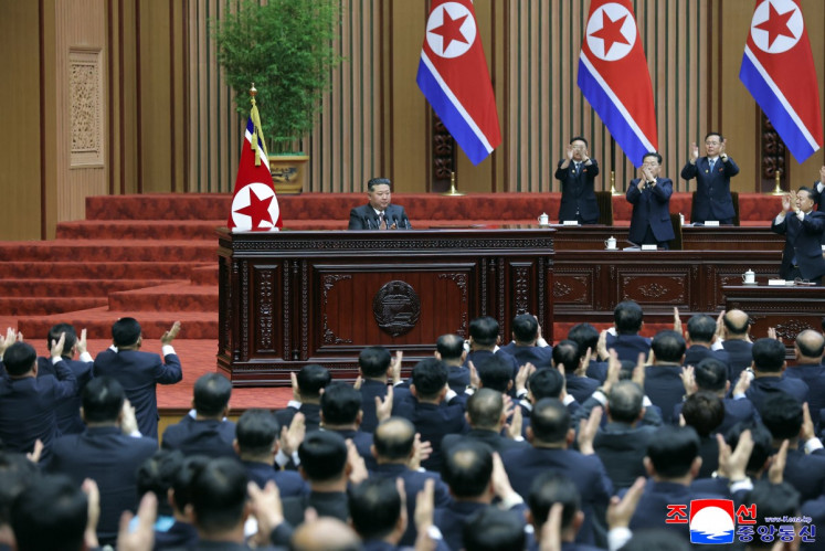 This picture taken on March 23, 2026 and released by North Korea's official Korean Central News Agency (KCNA) on March 24, 2026 shows North Korean leader Kim Jong Un (center) delivering a policy speech at the First Session of the 15th Supreme People's Assembly at the Assembly Hall in Pyongyang.