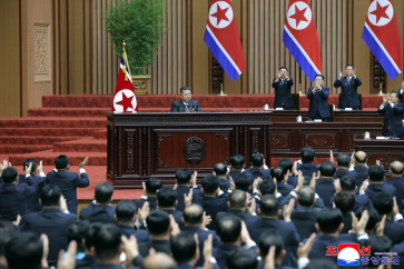 This picture taken on March 23, 2026 and released by North Korea's official Korean Central News Agency (KCNA) on March 24, 2026 shows North Korean leader Kim Jong Un (center) delivering a policy speech at the First Session of the 15th Supreme People's Assembly at the Assembly Hall in Pyongyang.
