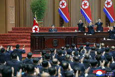 This picture taken on March 23, 2026 and released by North Korea's official Korean Central News Agency (KCNA) on March 24, 2026 shows North Korean leader Kim Jong Un (center) delivering a policy speech at the First Session of the 15th Supreme People's Assembly at the Assembly Hall in Pyongyang.