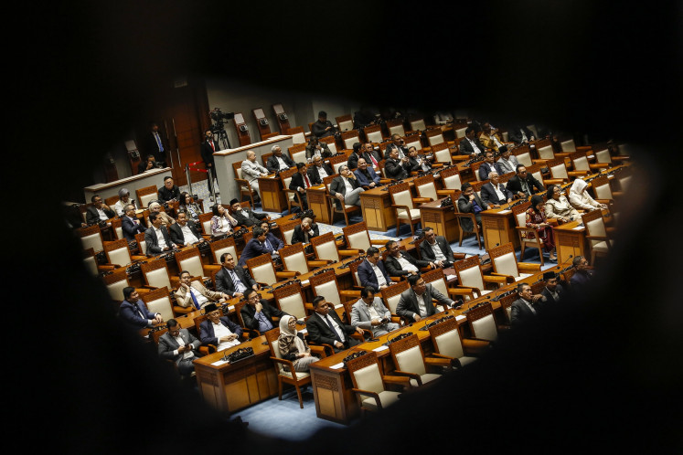 House of Representatives lawmakers attend a plenary session at the Senayan Legislative Complex in Central Jakarta on March 10, 2026.