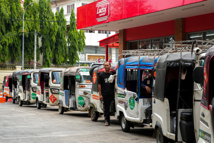 Fuel crisis: Small motorized three-wheeled passenger vehicles, commonly called tuk-tuks, line up to fill up on liquefied petroleum gas (LPG) and gasoline at a gas station on March, 24, 2026, amid the United States-Israeli war on Iran, in Phnom Penh.