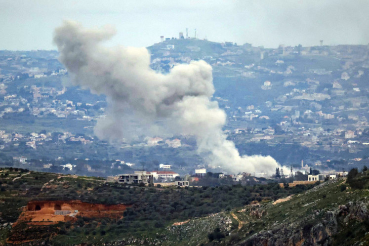 Heralding destruction: Smoke rises from the site of an Israeli air strike on Wednesday, March 25, 2026, that targeted the southern Lebanese village of Dayr Seryan.