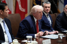 US President Donald Trump holds a Sharpie pen that was custom-made for the White House, during a cabinet meeting at the White House in Washington on March 26, 2026.