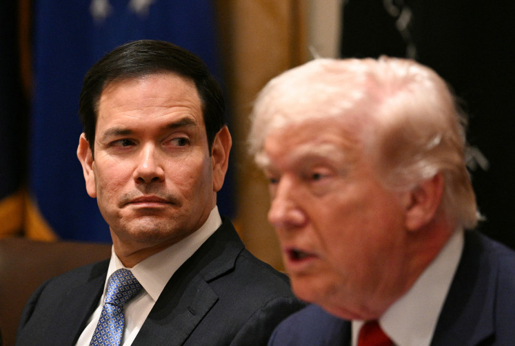 Wandering eyes: United States Secretary of State Marco Rubio (left) looks askance as President Donald Trump speaks on Thursday, March 26, 2026, during a meeting in the Cabinet Room of the White House in Washington, DC.