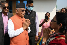 Khadga Prasad Sharma Oli (second left), Nepal's former prime minister and Communist Party of Nepal-Unified Marxist Leninist (CPN-UML) leader, greets supporters during a rally on the final day of campaigning ahead of the country's general election at Gauradaha in Jhapa district, Nepal on March 2, 2026.