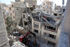 Firefighters look for victims and inspect damages at a residential building in southern Tehran, Iran on March 27, 2026, nearly a month into the Middle East war. Israel's military said it carried out strikes on targets in Tehran early on March 27. Iran has been under heavy bombardment since Feb. 28, when the US and Israel launched their campaign.