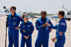 NASA astronauts Reid Wiseman (right) and Victor Glover (second right) greet each other next to NASA astronaut Christina Koch (second left) and Canadian Space Agency (CSA) astronaut Jeremy Hansen (left) at Kennedy Space Centre in Cape Canaveral, Florida, the United States on March 27, 2026, ahead of the Artemis II launch.