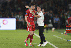 Indonesia's men soccer team head coach John Herdman (right) instructs on March 27, 2026, defender Kevin Diks during the 2026 FIFA Series match at the Gelora Bung Karno (GBK) main stadium in Central Jakarta.