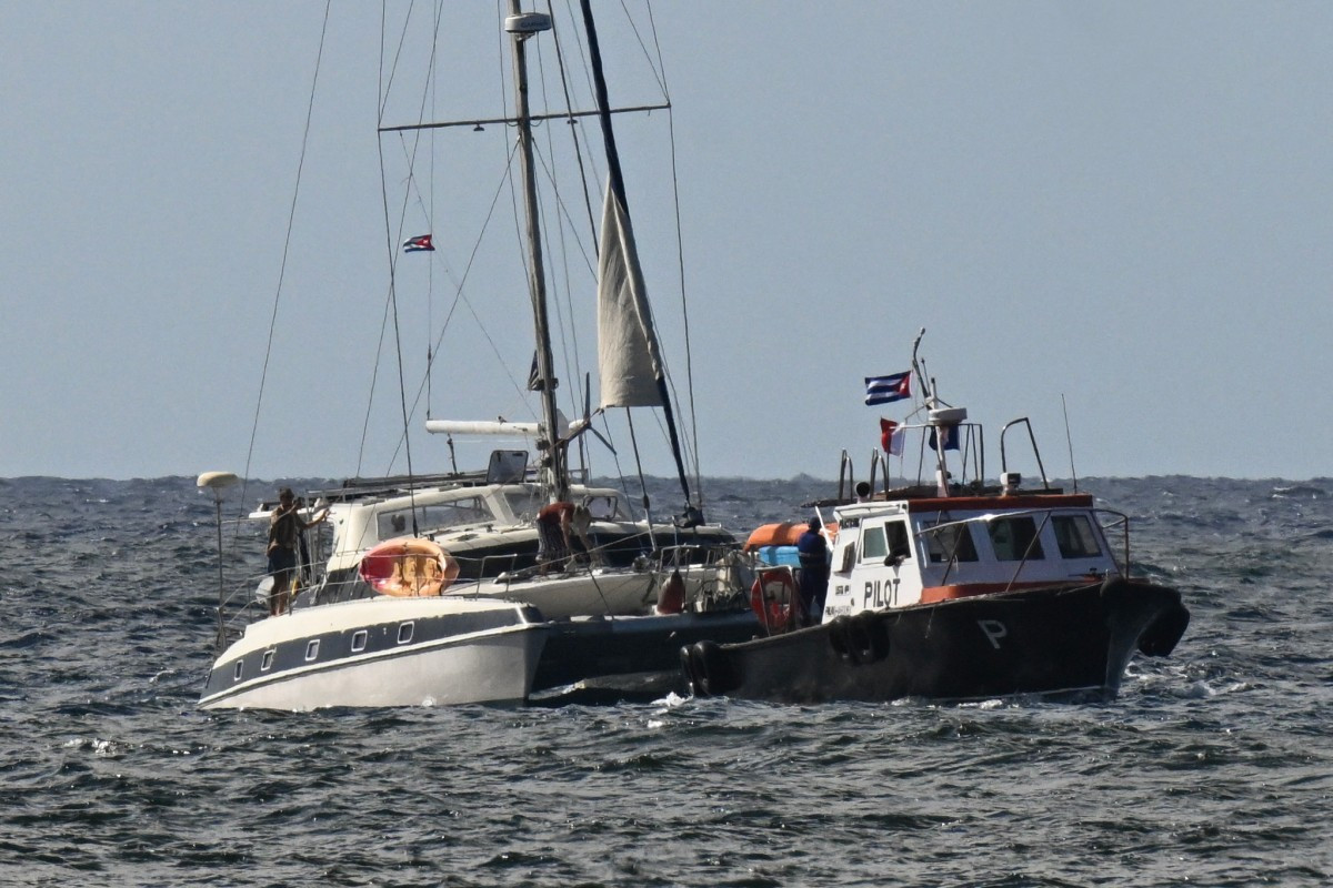 This view shows one of the two sailboats (left) carrying humanitarian aid that had previously gone missing arriving at the port of Havana on March 28, 2026. Two sailboats carrying humanitarian aid to crisis-hit Cuba reached Havana on Saturday after a long journey from Mexico during which they went missing and triggered a search-and-rescue mission.